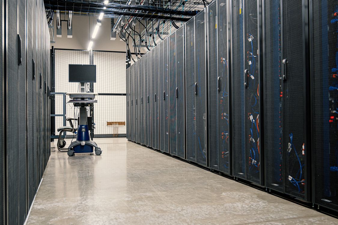 A corridor of server racks in a modern data center