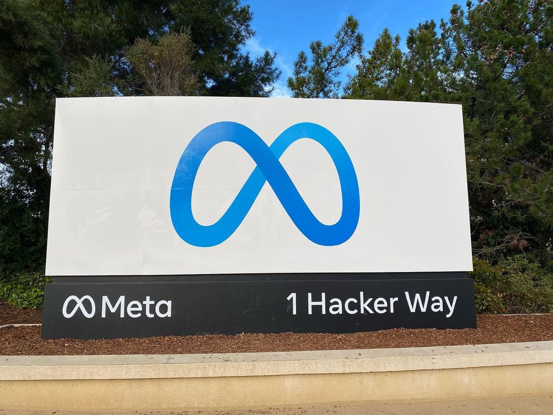The Meta headquarters sign with the Meta loop logo at 1 Hacker Way
