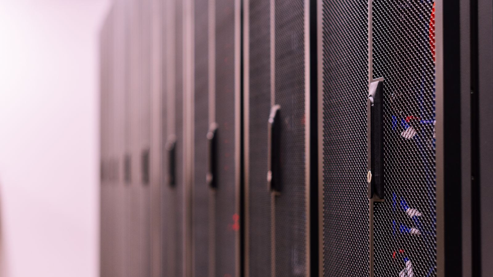 Row of black server racks in a data center